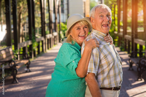 Senior woman hugging man. Elderly couple is laughing. Trust and support. Live entire life together. © DenisProduction.com
