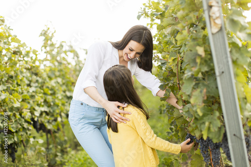 Mother and daughter in vine...