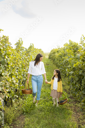 Mother and daughter in vine...