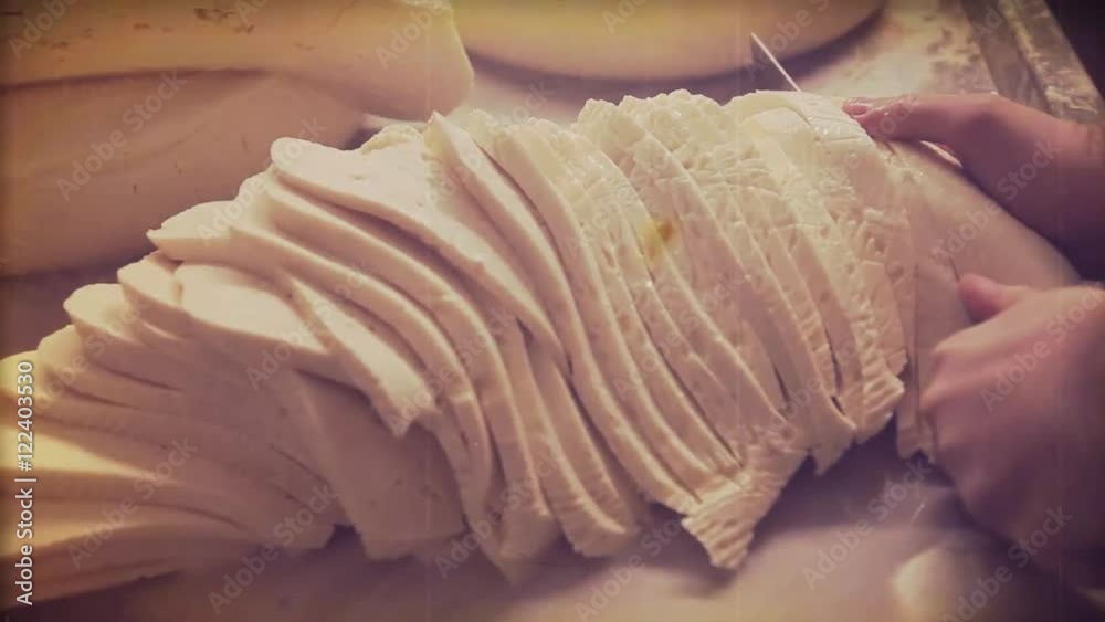 Making cheese traditional manually. Cutting the cheese Making cheese traditional manually. Cutting the cheese