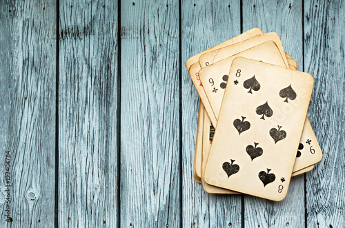 Pack of cards on wooden background