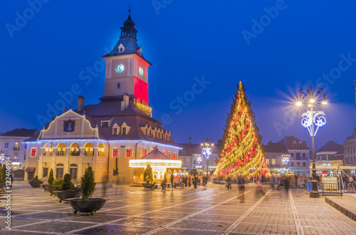 Decorated Christmas tree and lights in the main square of Brasov, beautiful medieval town of Transylvania, Romania