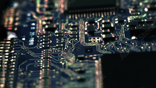 Circuit Board / Processor Chips / Data Streams. Macro tracking over circuit board with conceptual image of the red-green electrical signals flowing in electrical conductors.