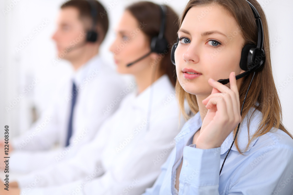 Call center operators. Young beautiful business woman in headset. Call center operators. Young beautiful business woman in headset.