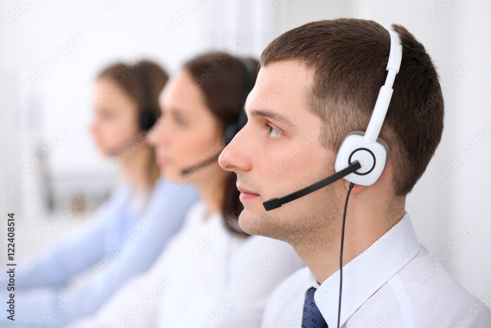 Call center operators. Young business man in headset. Call center operators. Young business man in headset.
