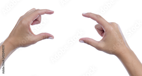 Female caucasian hand gesturing a small amount isolated on white background. 