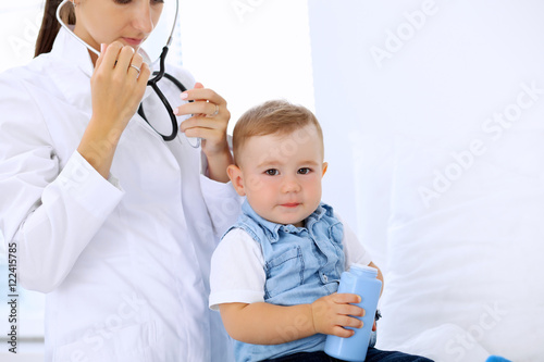 Little boy child at health exam at doctor's office