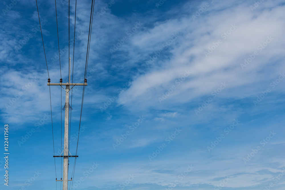 electrical post by the road against blue sky electrical post by the road against blue sky