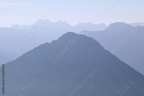 mountain silhouette in morning fog