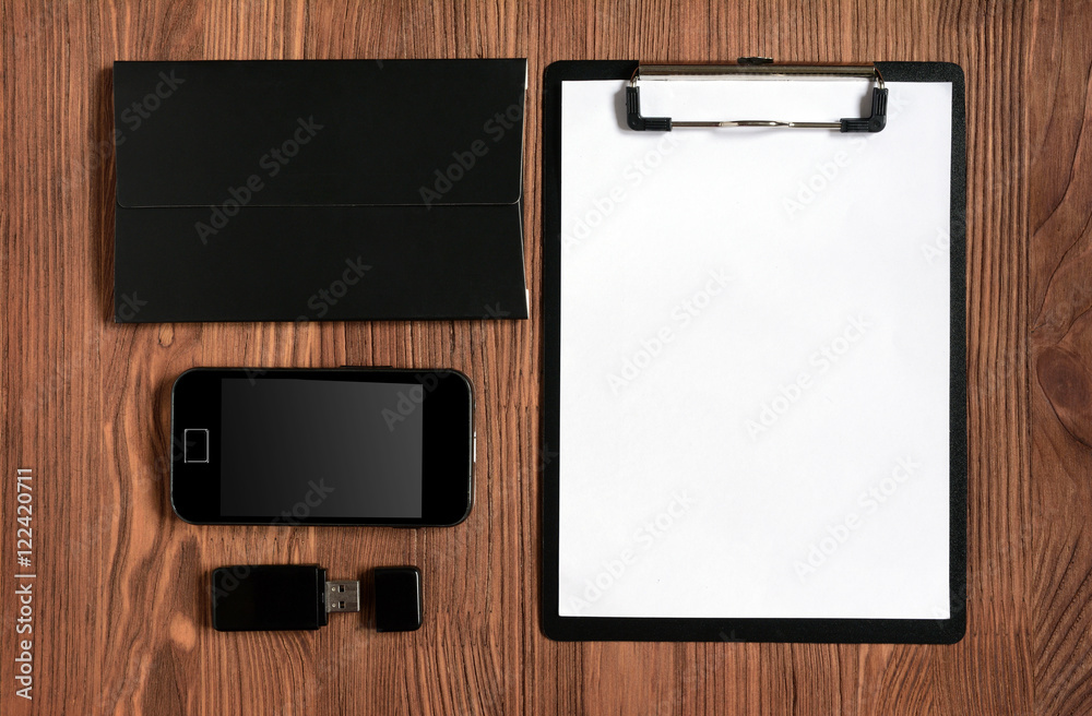 Set of stationery with clipboard, notepad, smartphone and flash driver Set of stationery with clipboard, notepad, smartphone and flash driver