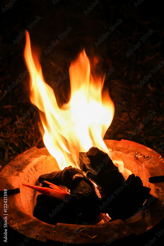 Flame in traditional fireplace kitchen in Thailand.