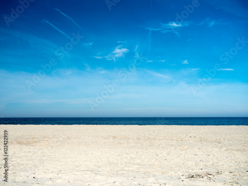 View of the beach, sea and sky on a sunny day.