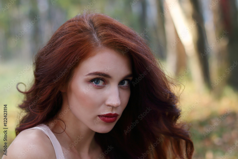 Beautiful girl with red curly hair poses in forest, shallow dof, Beautiful girl with red curly hair poses in forest, shallow dof,