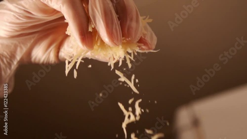 Topping cheese in slow motion