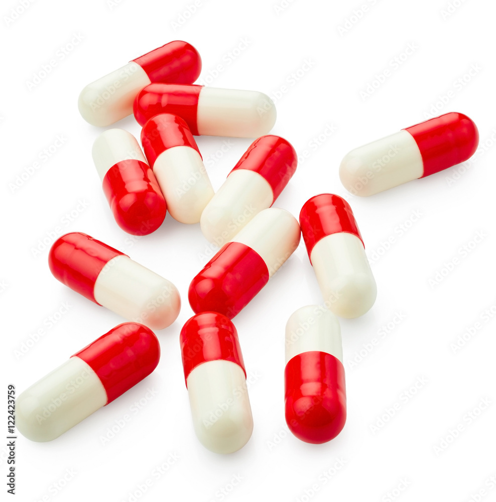 White and red pills isolated on white background White and red pills isolated on white background