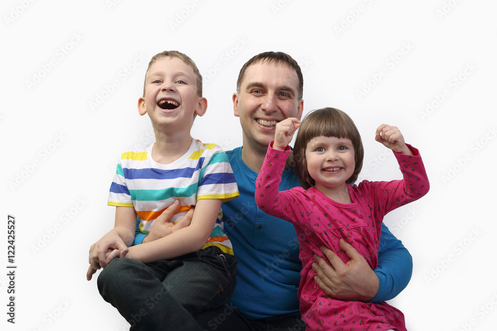 Adult male with little children portrait on light gray background - father, son and daughter - family relations and happiness concept Adult male with little children portrait on light gray background - father, son and daughter - family relations and happiness concept