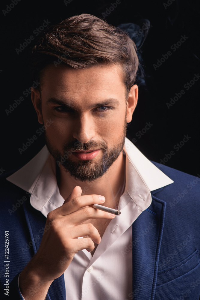 Handsome man relaxing with smoke Handsome man relaxing with smoke