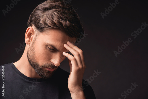 Pensive guy trying to solve a problem