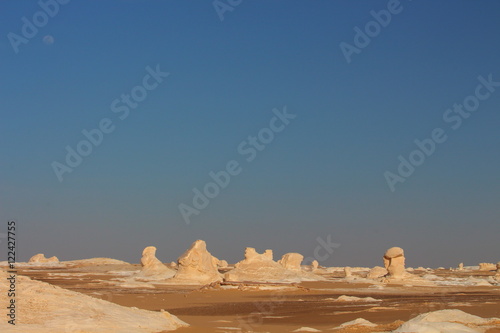 View of strange rock shapes due to erosion in White Desert close to Farafra oasis in Egypt.