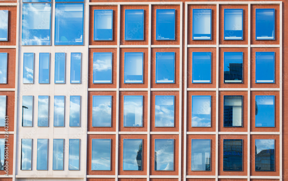 Exterior of modern office building in red bricks Exterior of modern office building in red bricks