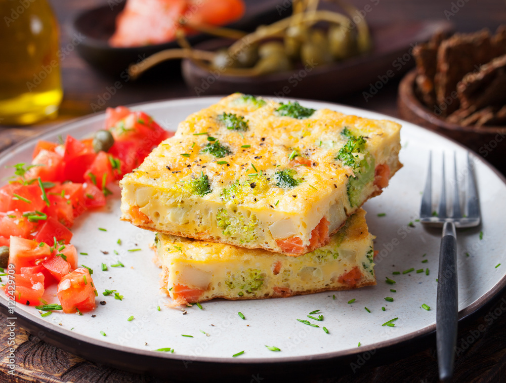 Omelet with smoked salmon and broccoli on a plate Omelet with smoked salmon and broccoli on a plate