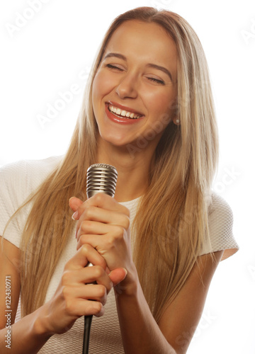 girl with a microphone singing and having fun