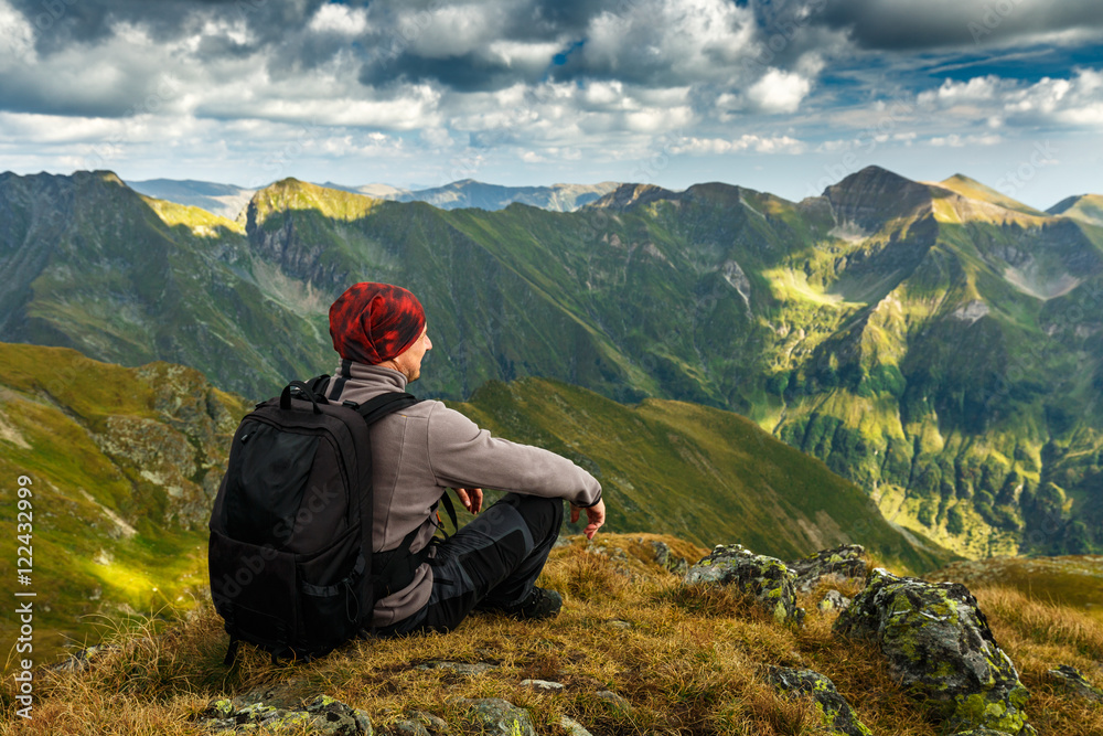 Hiker with backpack on mountains Hiker with backpack on mountains