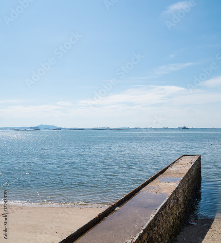 Stone brick jetty to the sea   Space and composition for text  