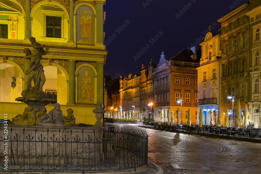 Night photo of Poznan Old Town with Prozerpin's fountain, beautifully decorated facade of the city hall and numerous highlighted townhouses.