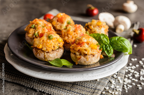 Mushrooms stuffed with rice, tomato, pea, corn and topped with mozzarella
