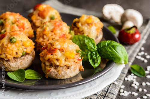 Mushrooms stuffed with rice, tomato, pea, corn and topped with mozzarella