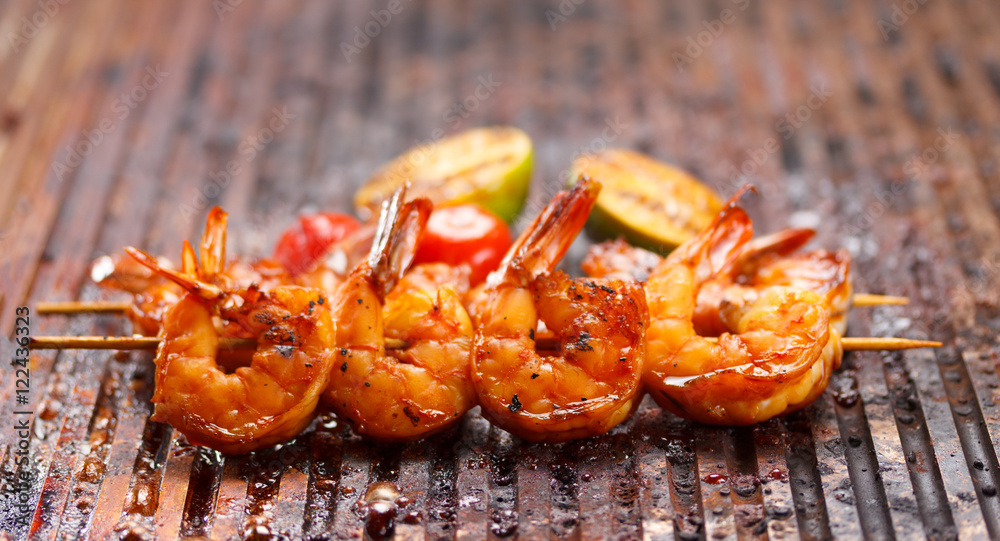 Fresh hot grilled shrimp skewers on the grill Fresh hot grilled shrimp skewers on the grill