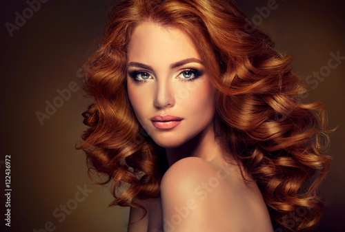 Fotografie, Obraz Girl with long  and   shiny wavy  red hair