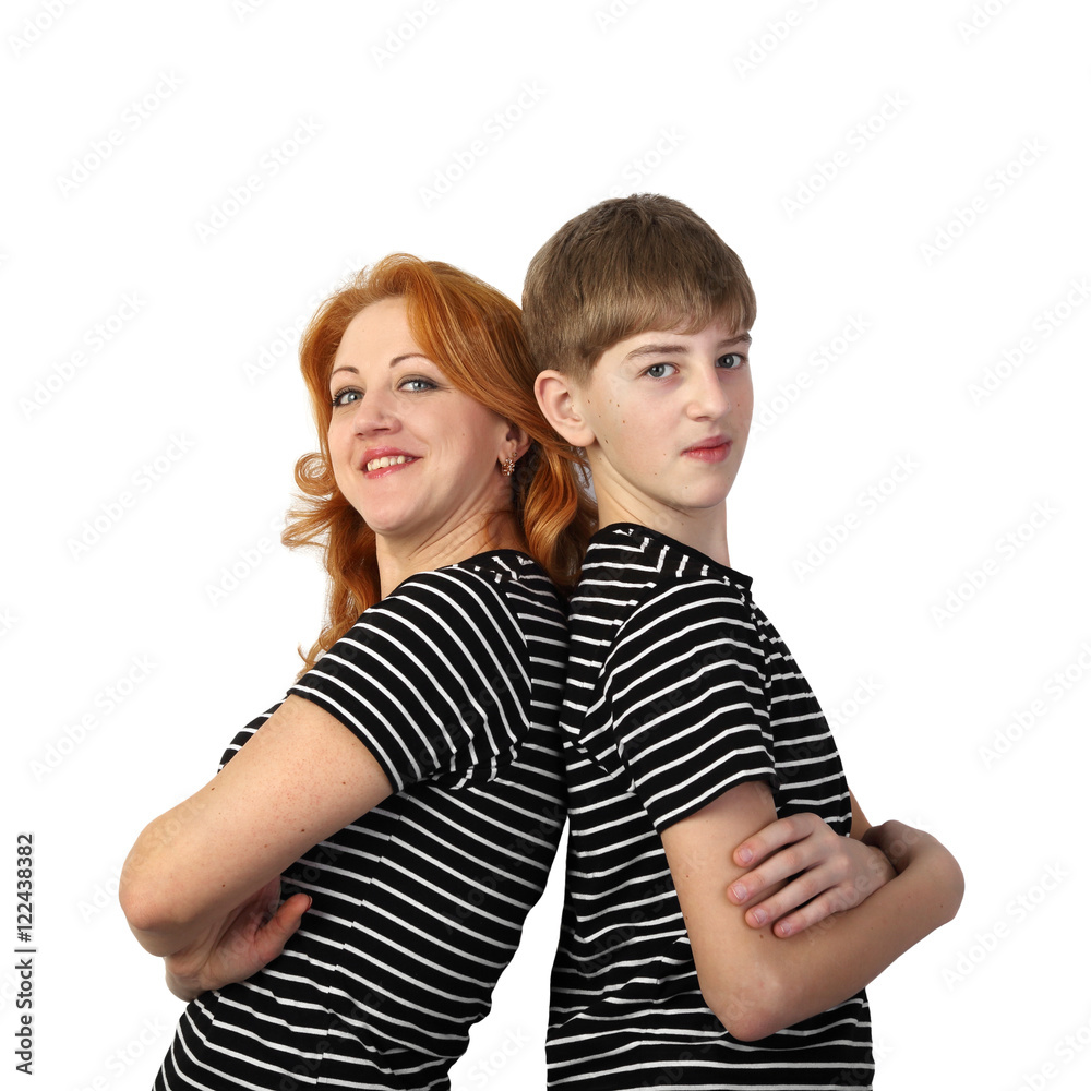 Redhead woman and teenage boy in similar t-shirts stand back to back and smile isolated on white background in square - mother and son, friendly family