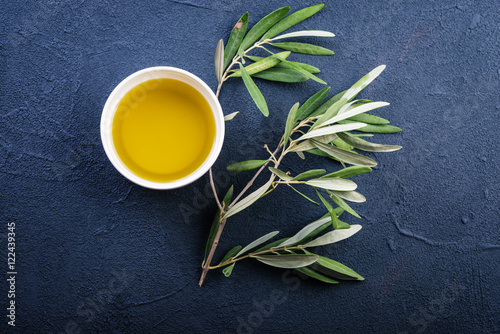 Olive branches and oil on a dark  background