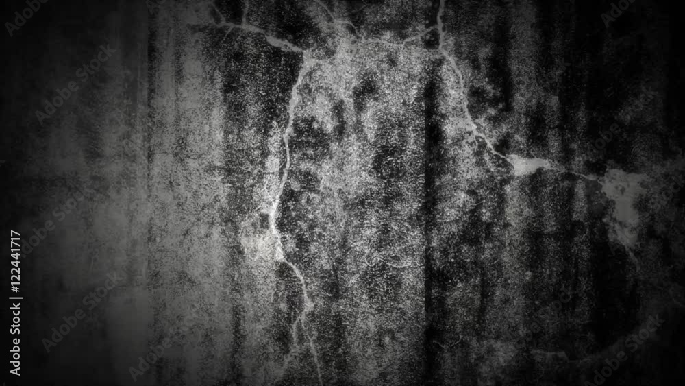 Abstract loop of white grunge over a black background.
