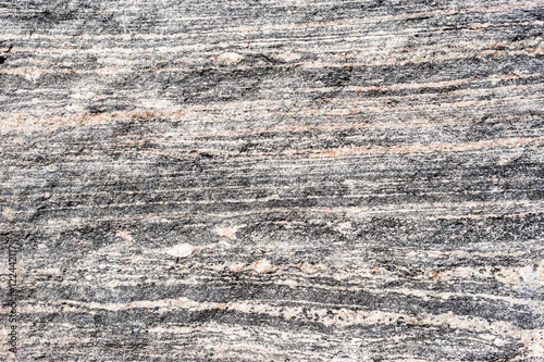 Layered metamorphic rock background texture.