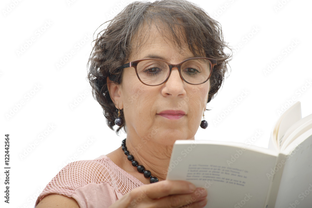 mature brunette woman reading a book