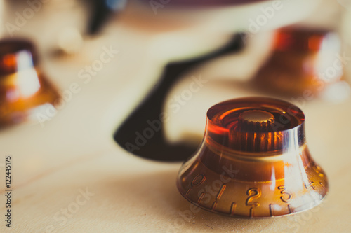 Electric guitar volume  knob detail, music symbol