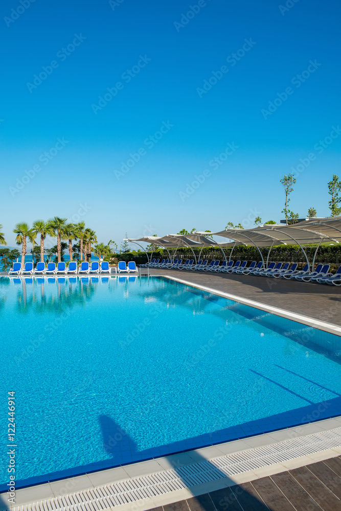 Nice swimming pool outdoors on bright summer day