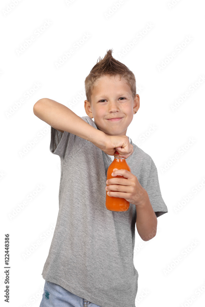 Teenage boy opens a bottle of carrot juice isolated on white background Teenage boy opens a bottle of carrot juice isolated on white background