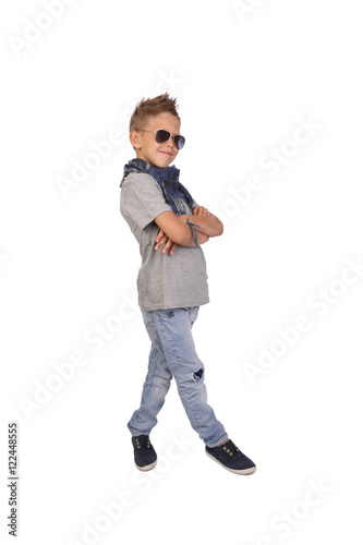 Teenage boy in sunglasses posing isolated on white background