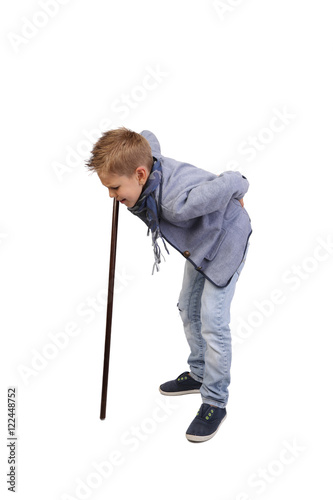 Teenage boy leans on cane depicting back pain isolated on white background - premature senility