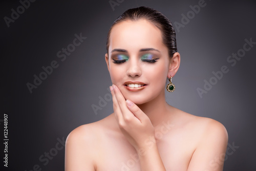 Beautiful woman showing off her jewellery in fashion concept