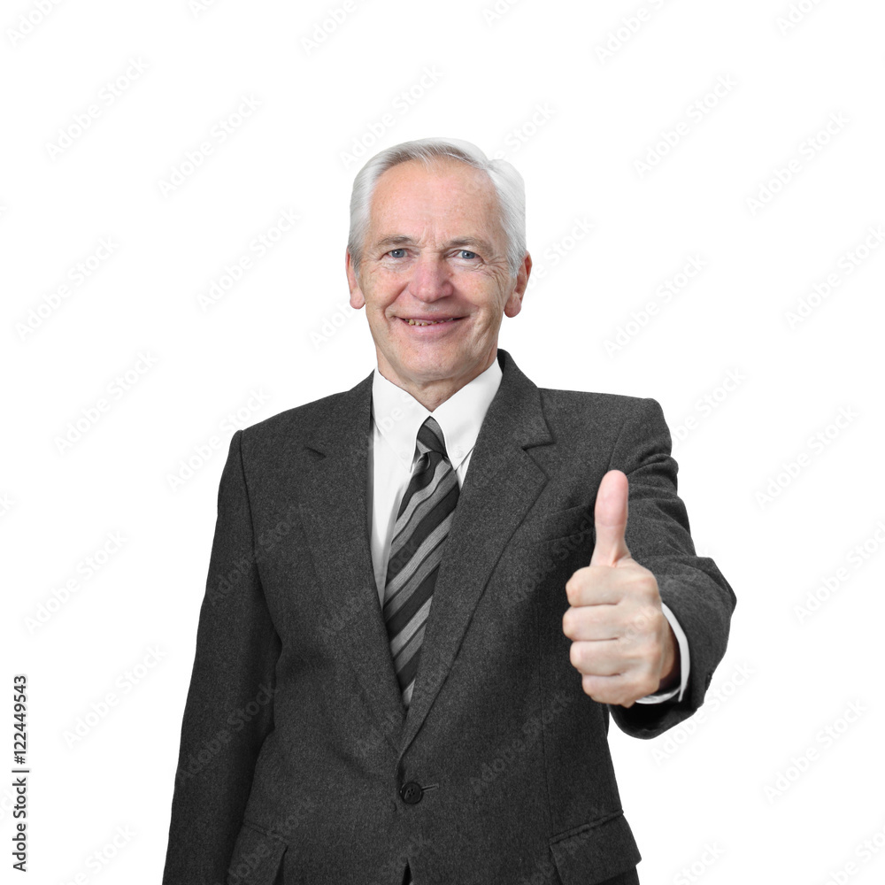 Senior man with friendly smiling face shows raised thumb isolated on white background Senior man with friendly smiling face shows raised thumb isolated on white background