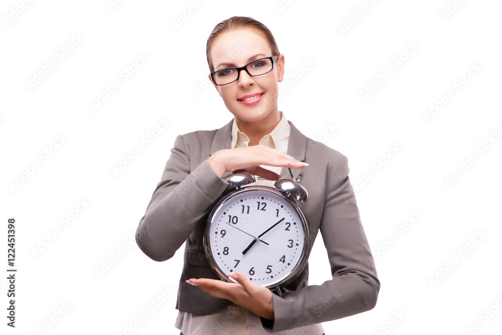 Businesswoman with giant alarm clock isolated on white Businesswoman with giant alarm clock isolated on white