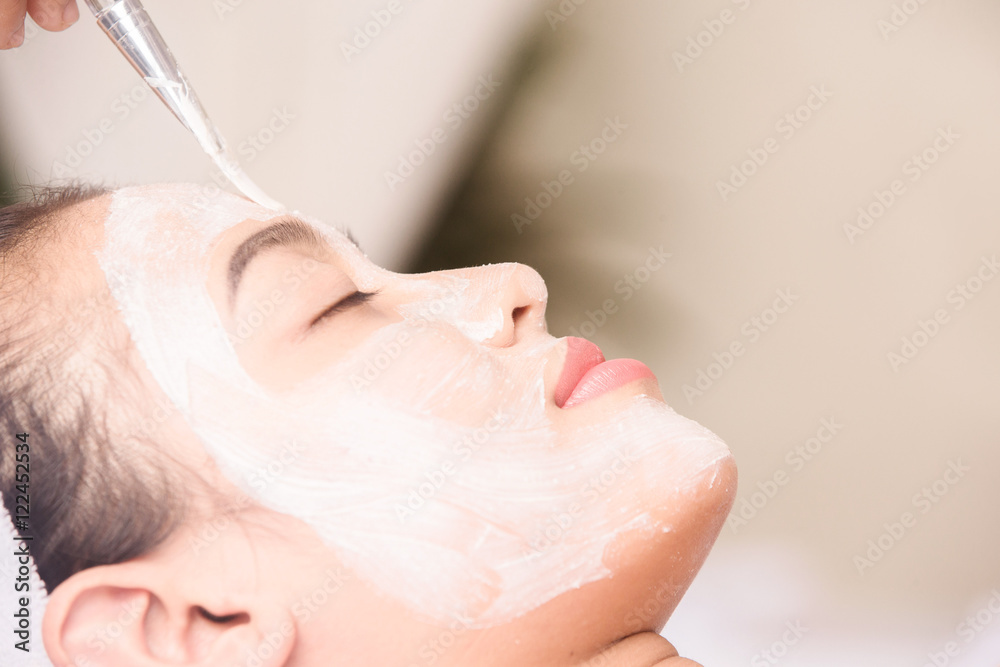 Young girl with facial mask at beauty salon
Young girl with facial mask at beauty salon