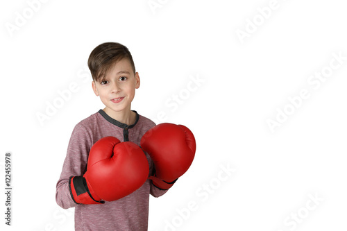 Pretty neat boy in red boxing gloves isolated on white background with copy space for text