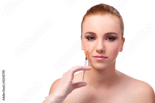 Young woman preparing for facial treatment isolated on white