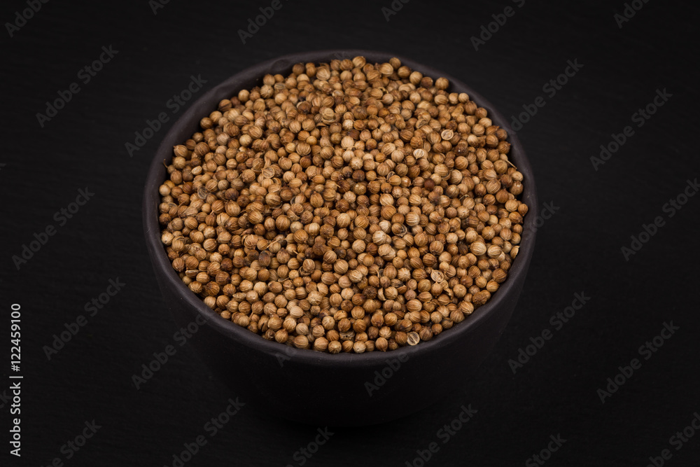 Coriander seeds in small bowl Coriander seeds in small bowl